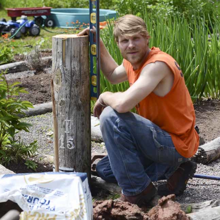 Plumb the post for a garden fence